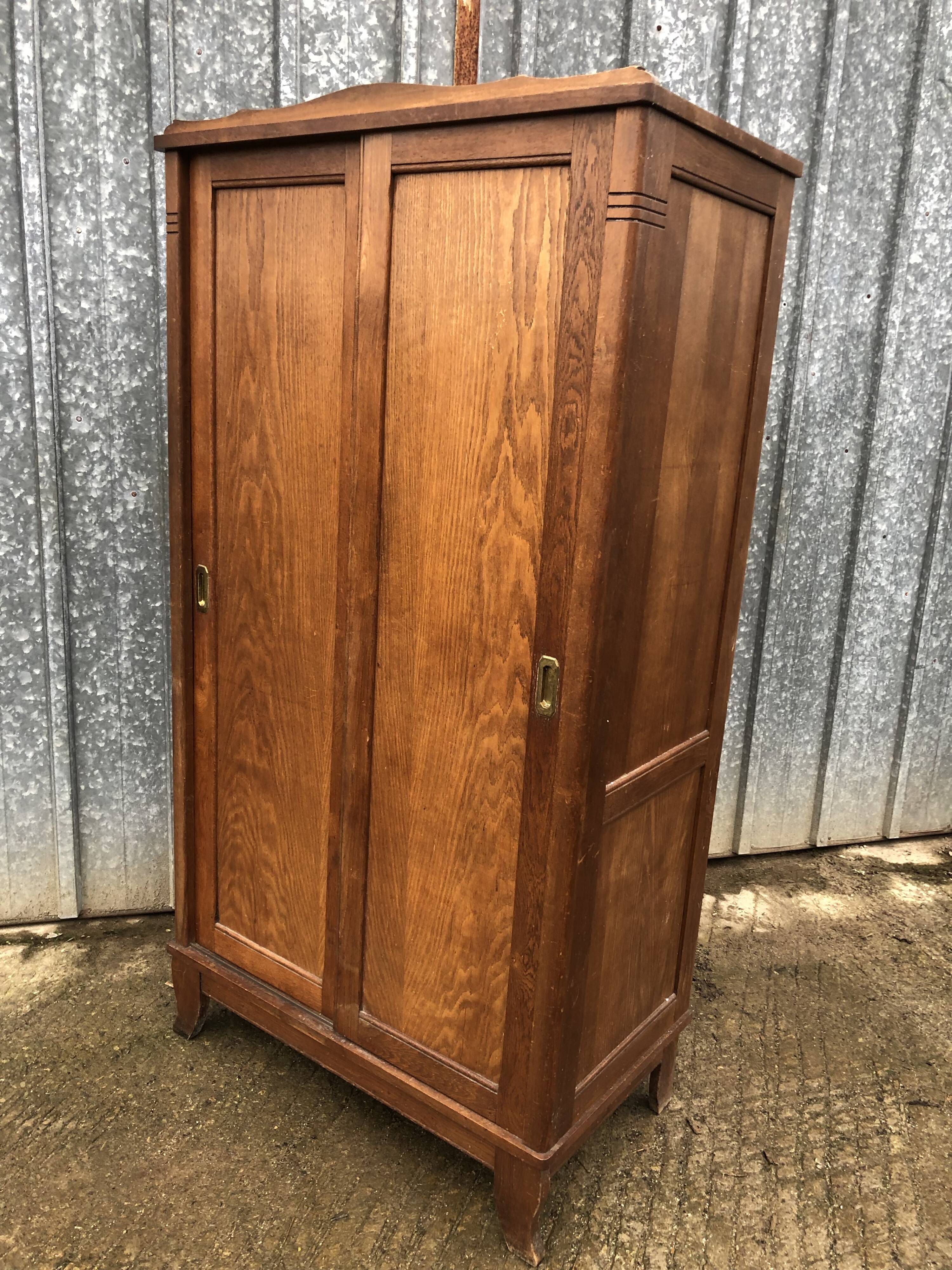 Vintage reconstruction period oak wardrobe with 2 sliding doors.