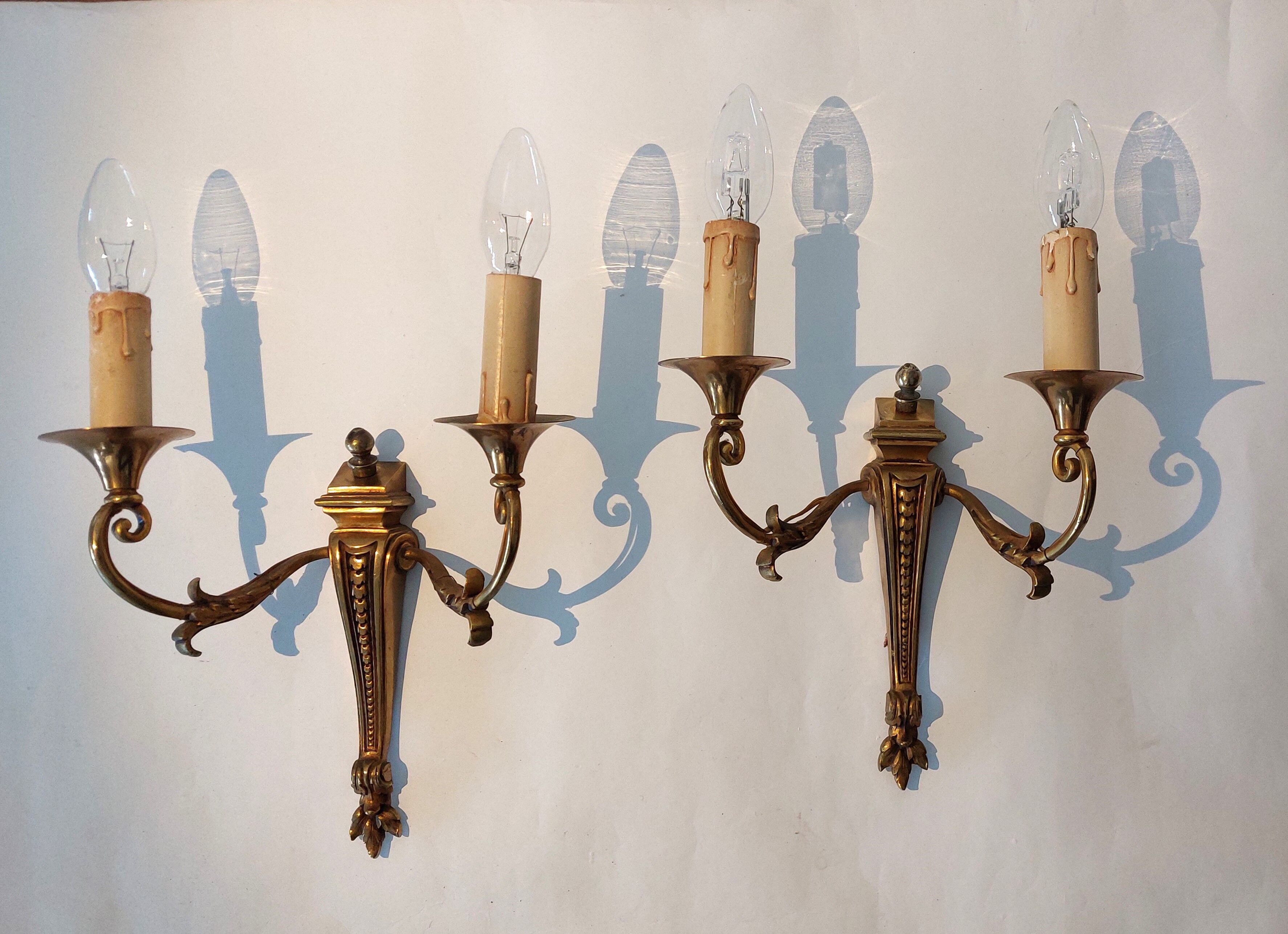 Pair of neoclassical sconces in bronze and gilded brass 1950.