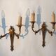 Pair of neoclassical sconces in bronze and gilded brass 1950.