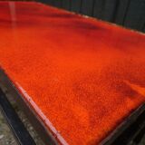 Coffee table in enamelled lava orange 70's