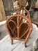 Magazine rack in turned wood and light brown rattan