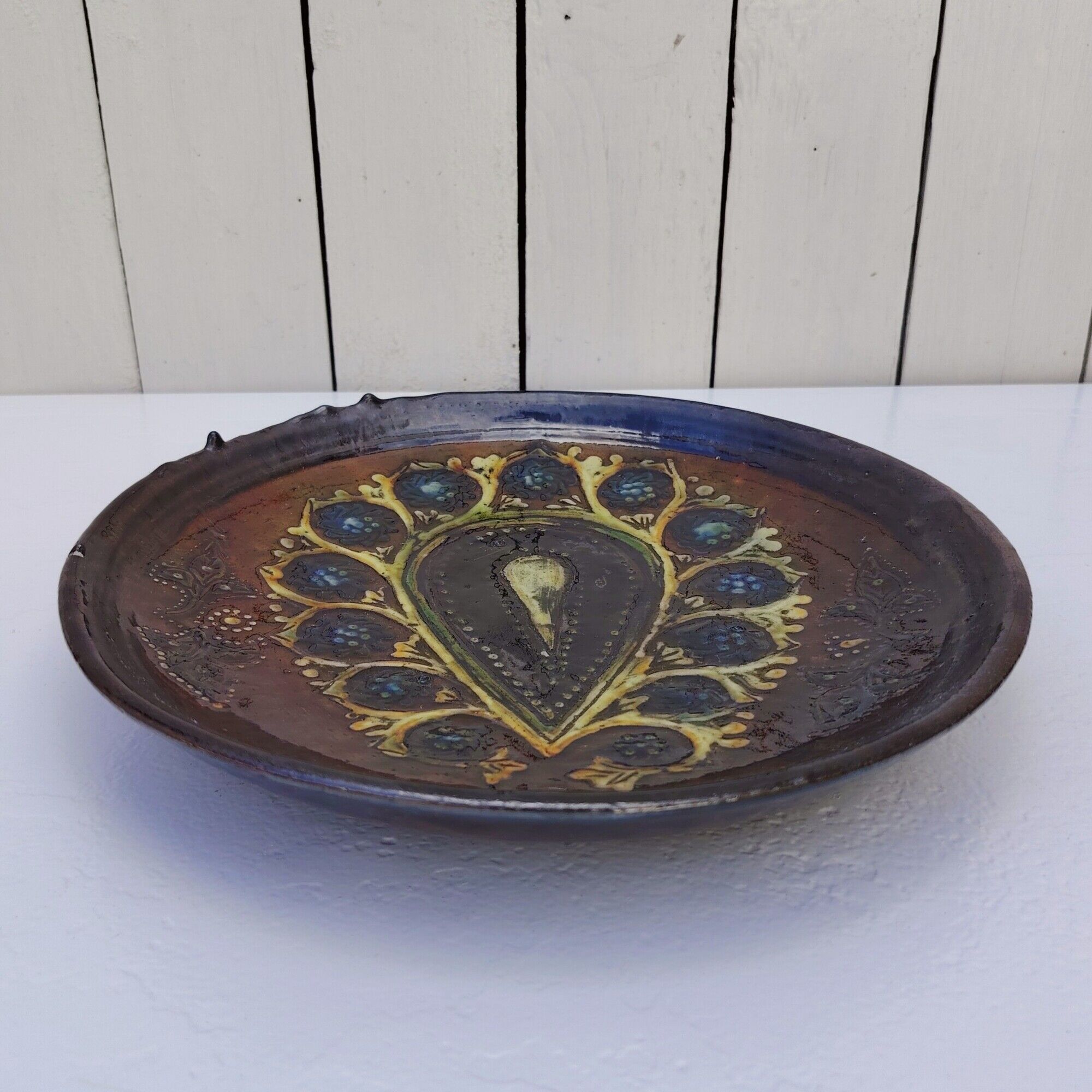 Decorative plate, glazed ceramic, floral design.