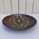 Decorative plate, glazed ceramic, floral design.
