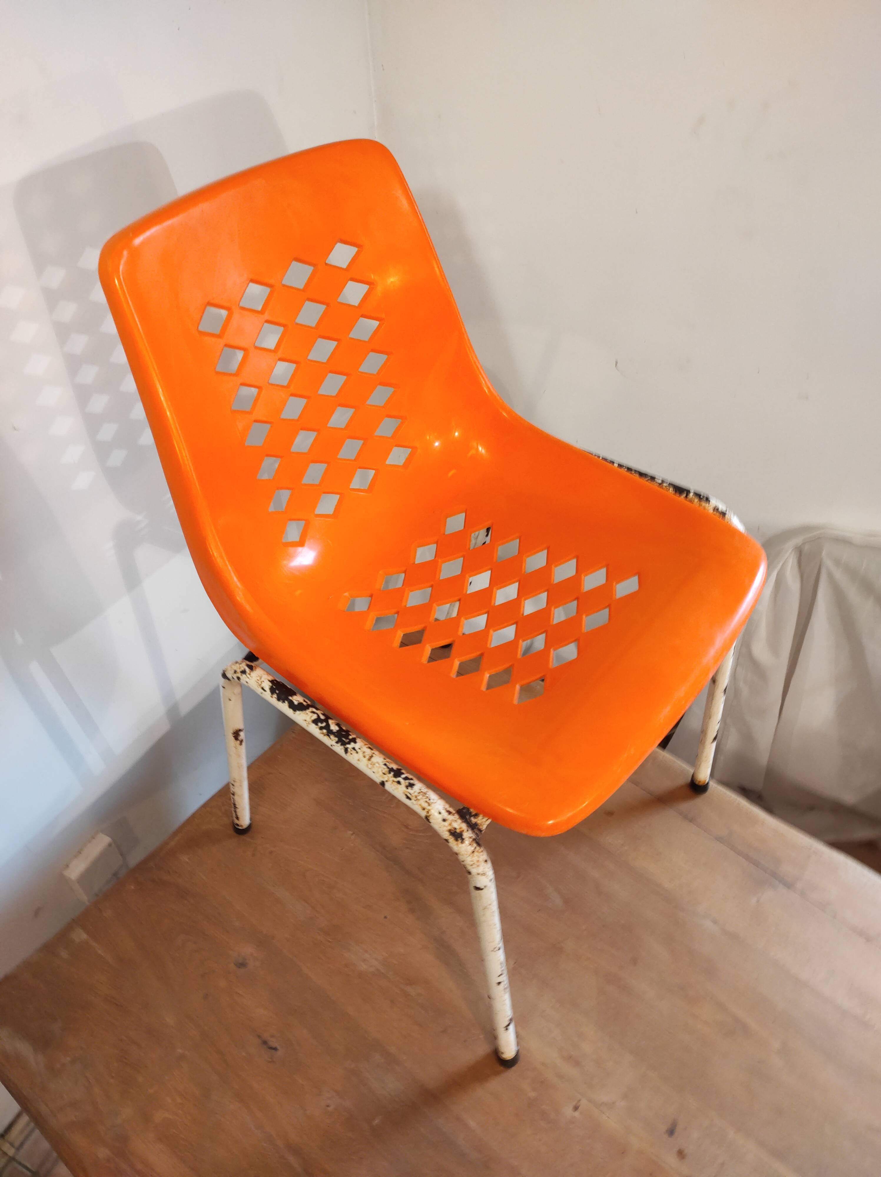 Chair with openwork plastic shell 1970