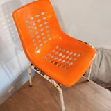 Chair with openwork plastic shell 1970