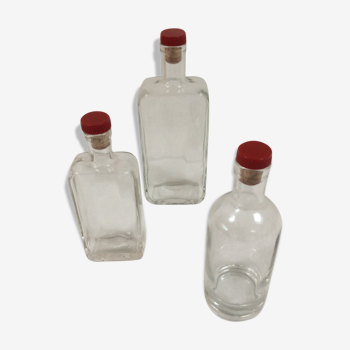 Trio of old glass bottles