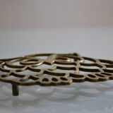 Vintage openwork brass trivet in the shape of an owl or owl