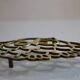 Vintage openwork brass trivet in the shape of an owl or owl