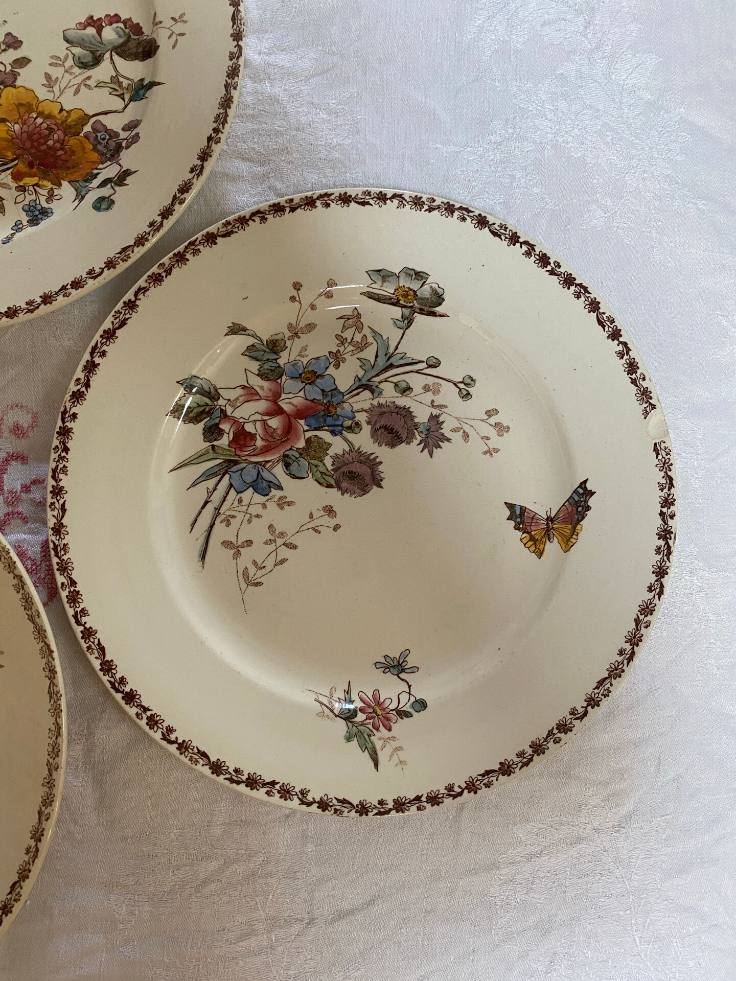 Set of 3 flat plates in polychrome ironstone E. Bourgeois