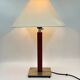 Vintage table lamp with a square wooden column and brushed steel base.