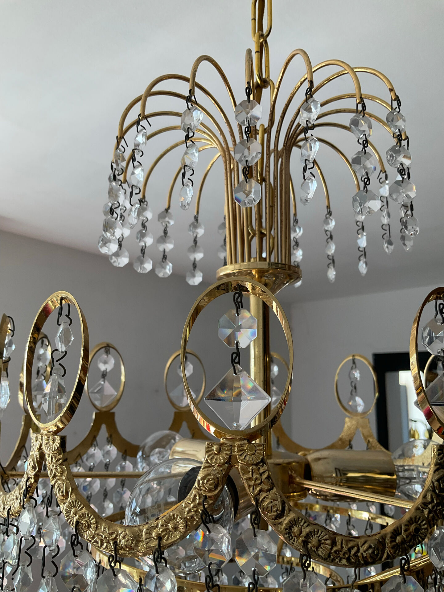 Brass chandelier with crystal pendants from the 1970s.