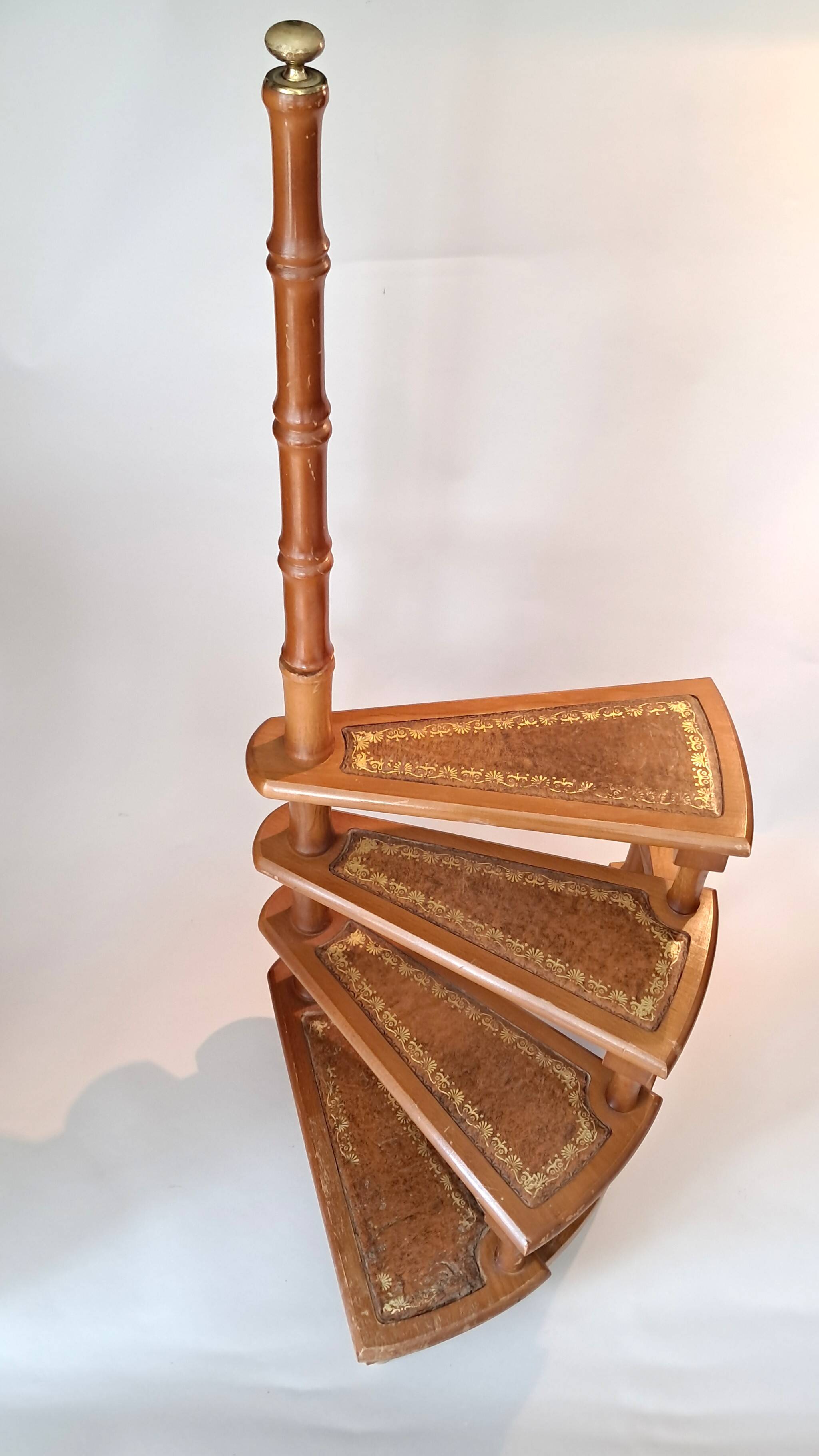 Library spiral staircase in beech and brown leather.