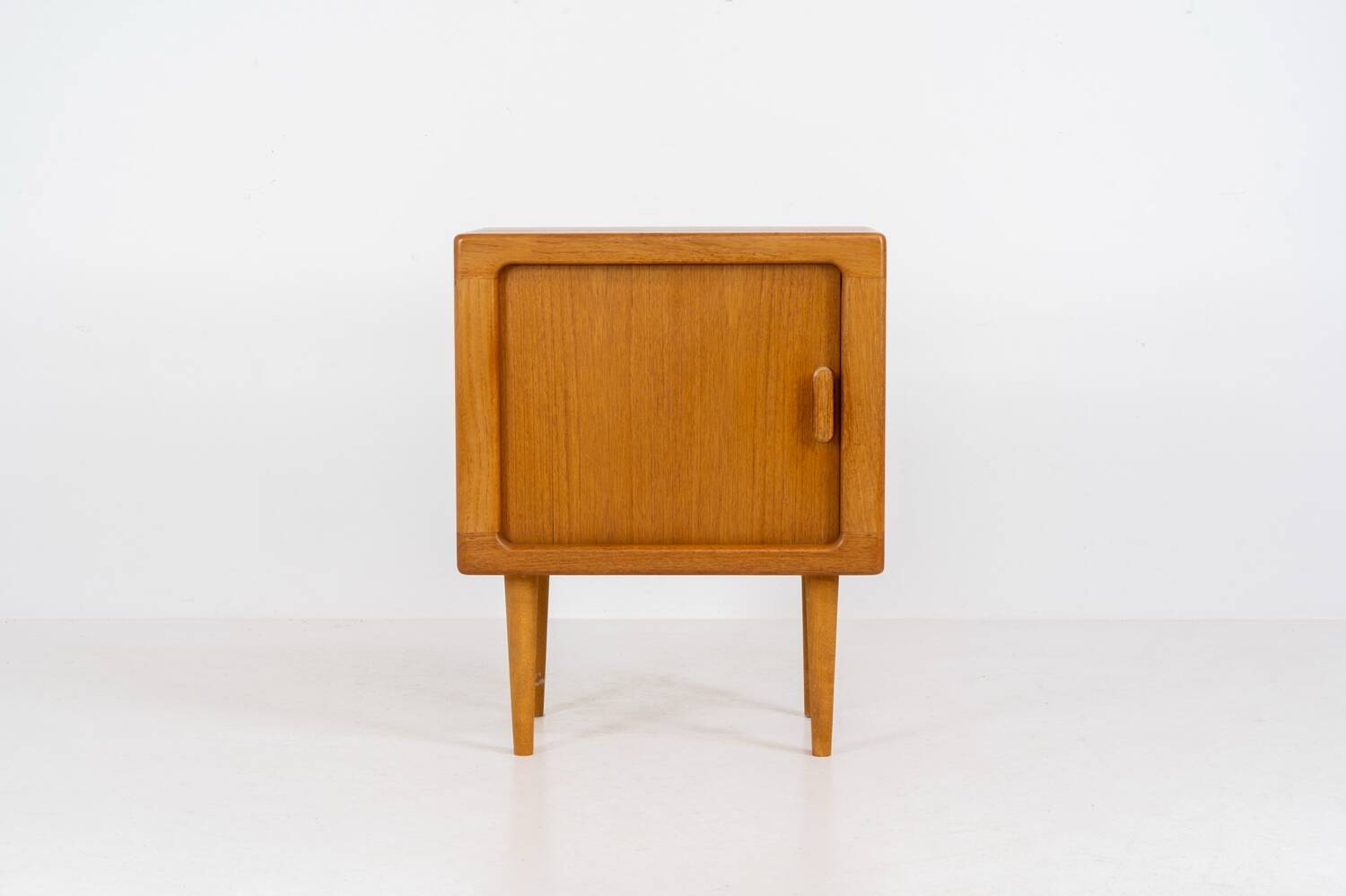 Compact cabinet with tambour door by CFC Silkeborg (Denmark, 1960s).