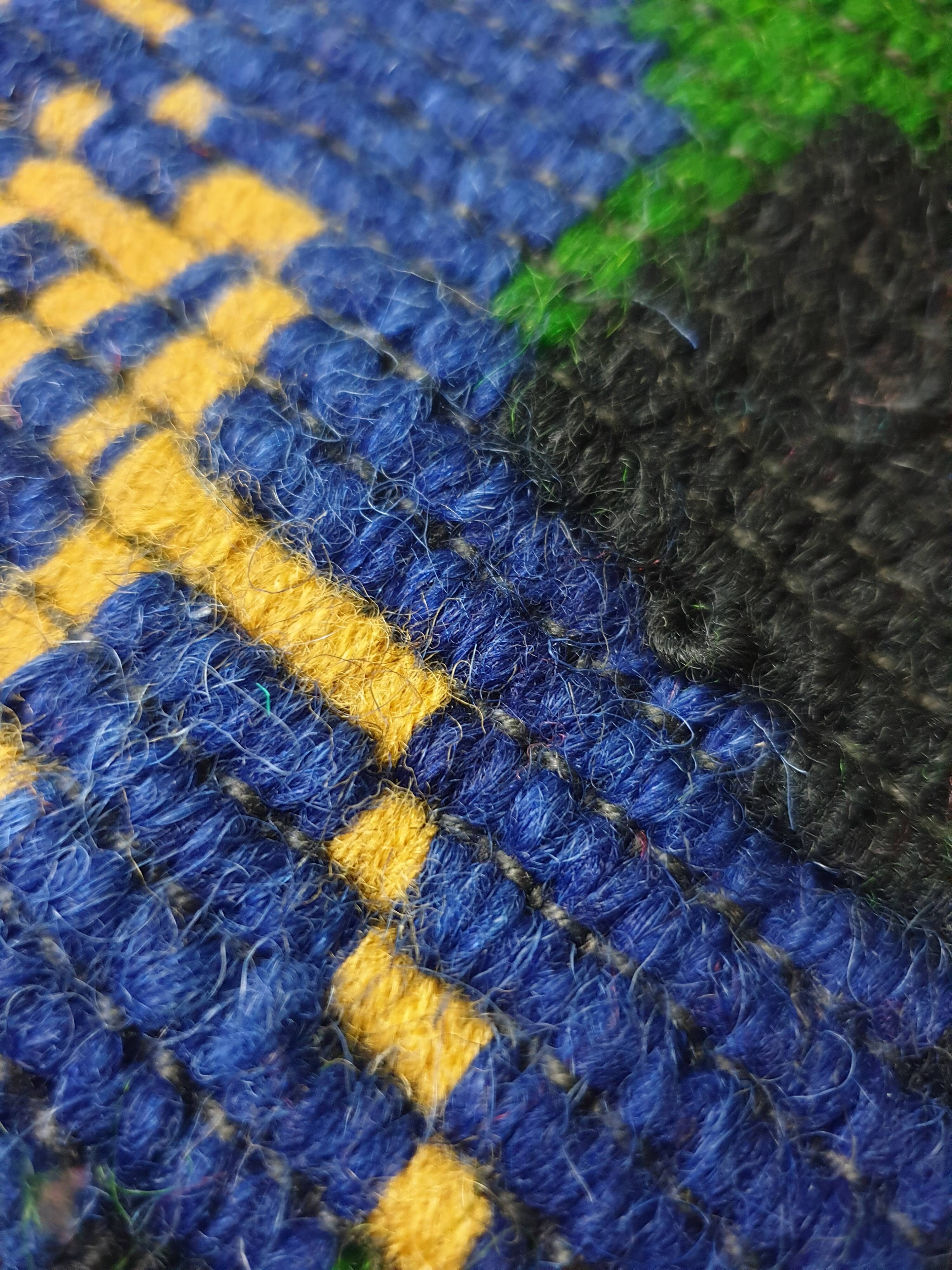 Handwoven floral wool rug, black background with pink roses and geometric design 207x144cm