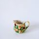 Tea service consisting of a teapot, a milk jug and a numbered hazelnut slip sugar bowl