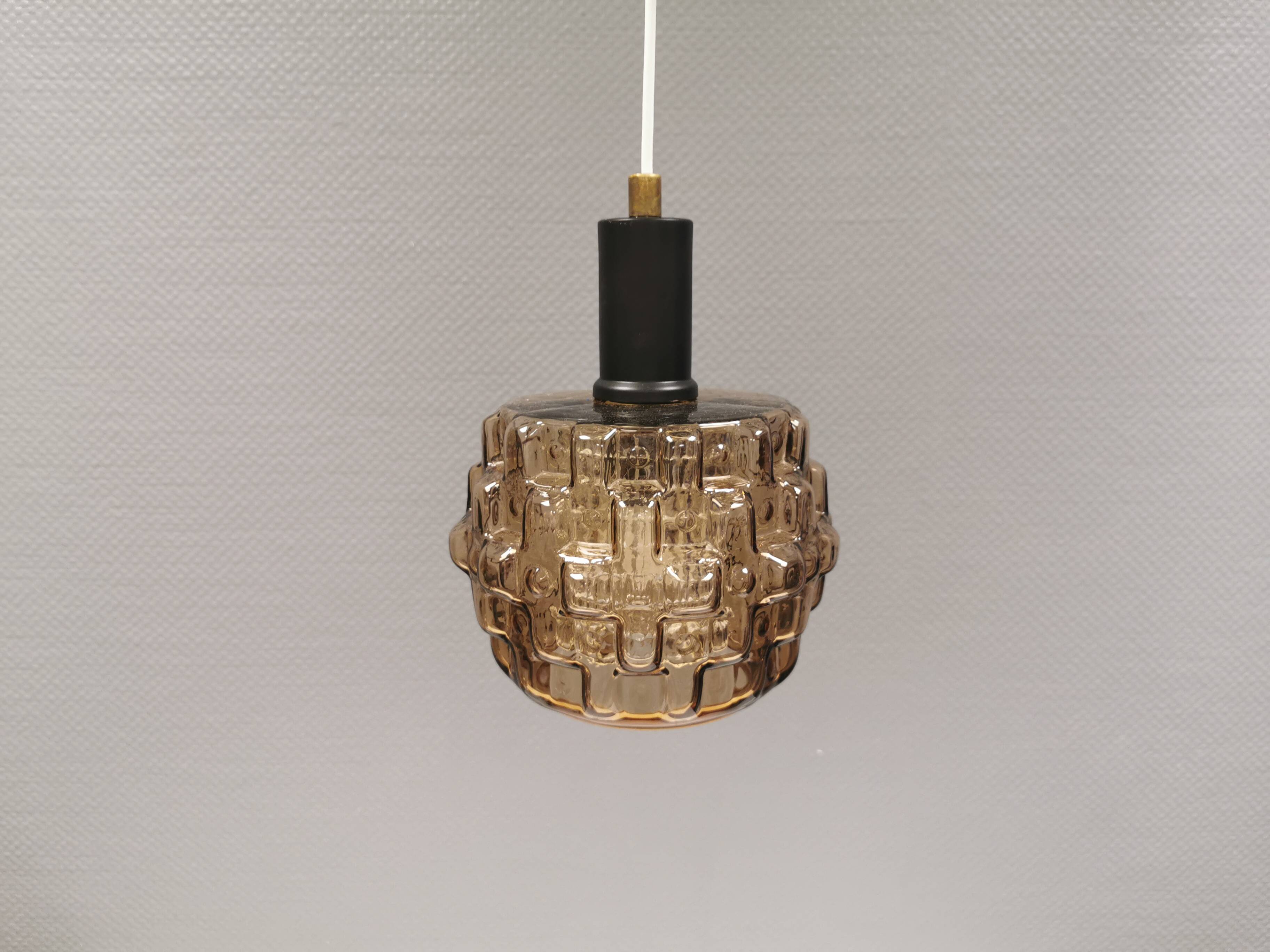 Older hanging lamp with champagne colored outer glass with inner shade of crystal glass.