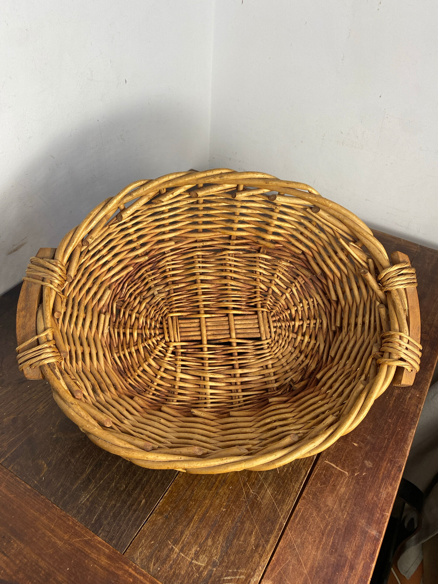 Wicker basket with wooden handles