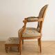 Armchair and footrest set in Louis XVI style