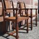 Pair of oak armchairs with straw seats and backs.