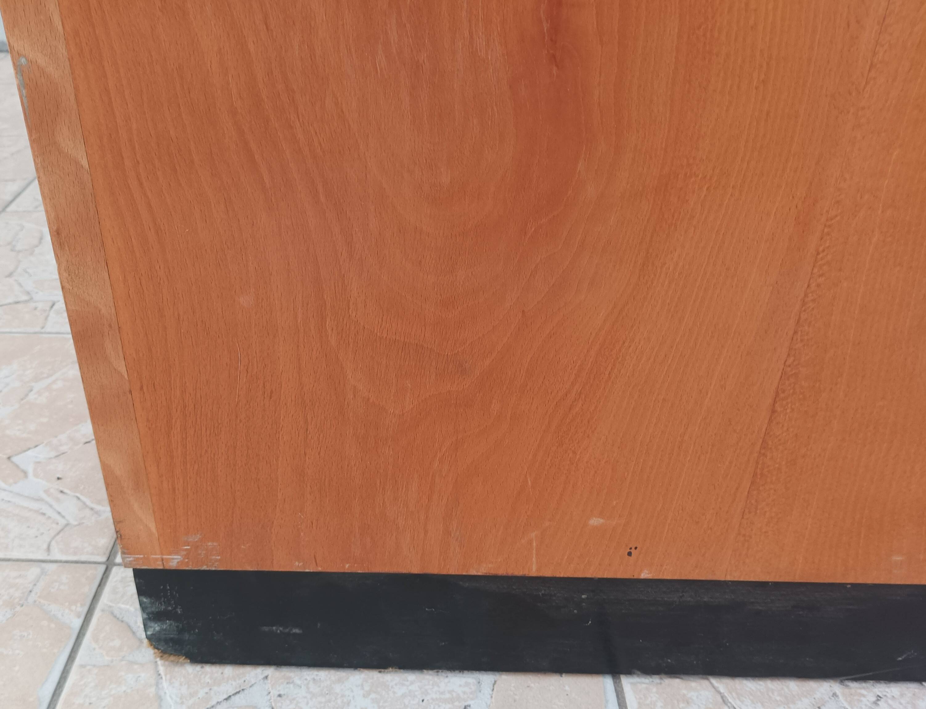 Workshop furniture with drawers and curtain in beech and walnut.