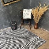 Romanian floral rug handwoven in wool, white and black background