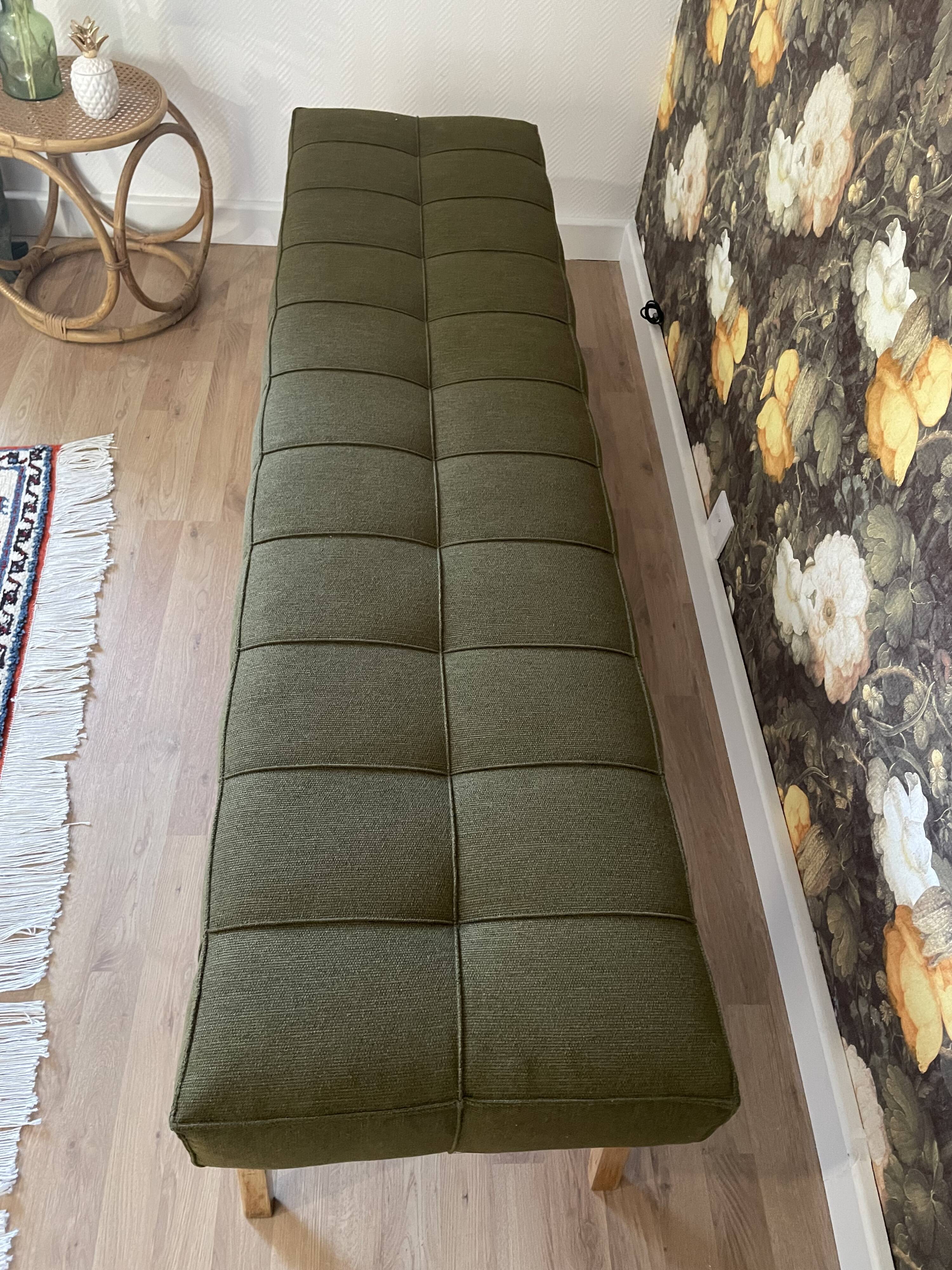 Wooden bench and green fabric