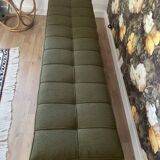 Wooden bench and green fabric