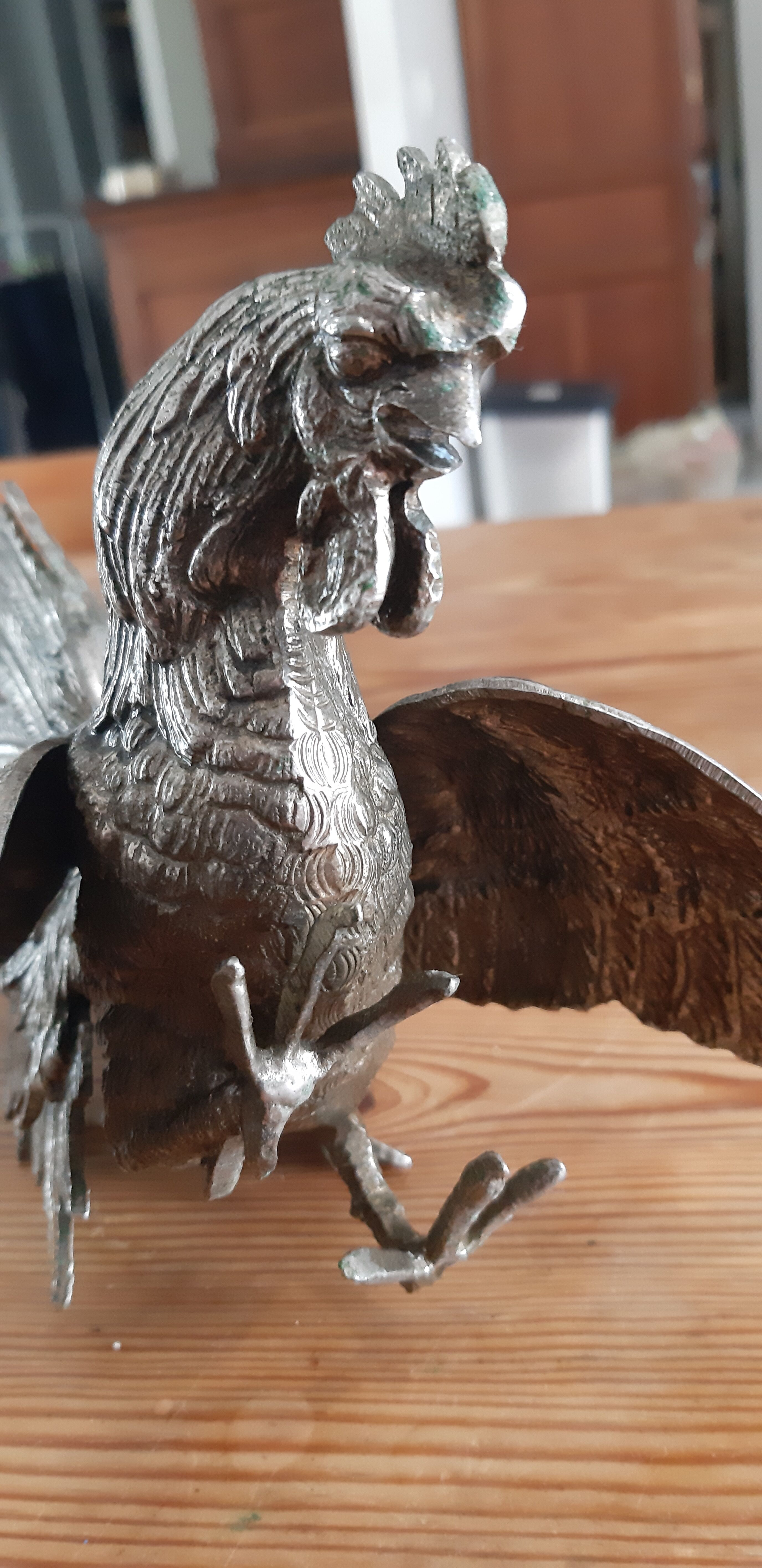 2 silver metal roosters