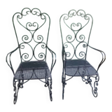 Pair of black wrought iron armchairs