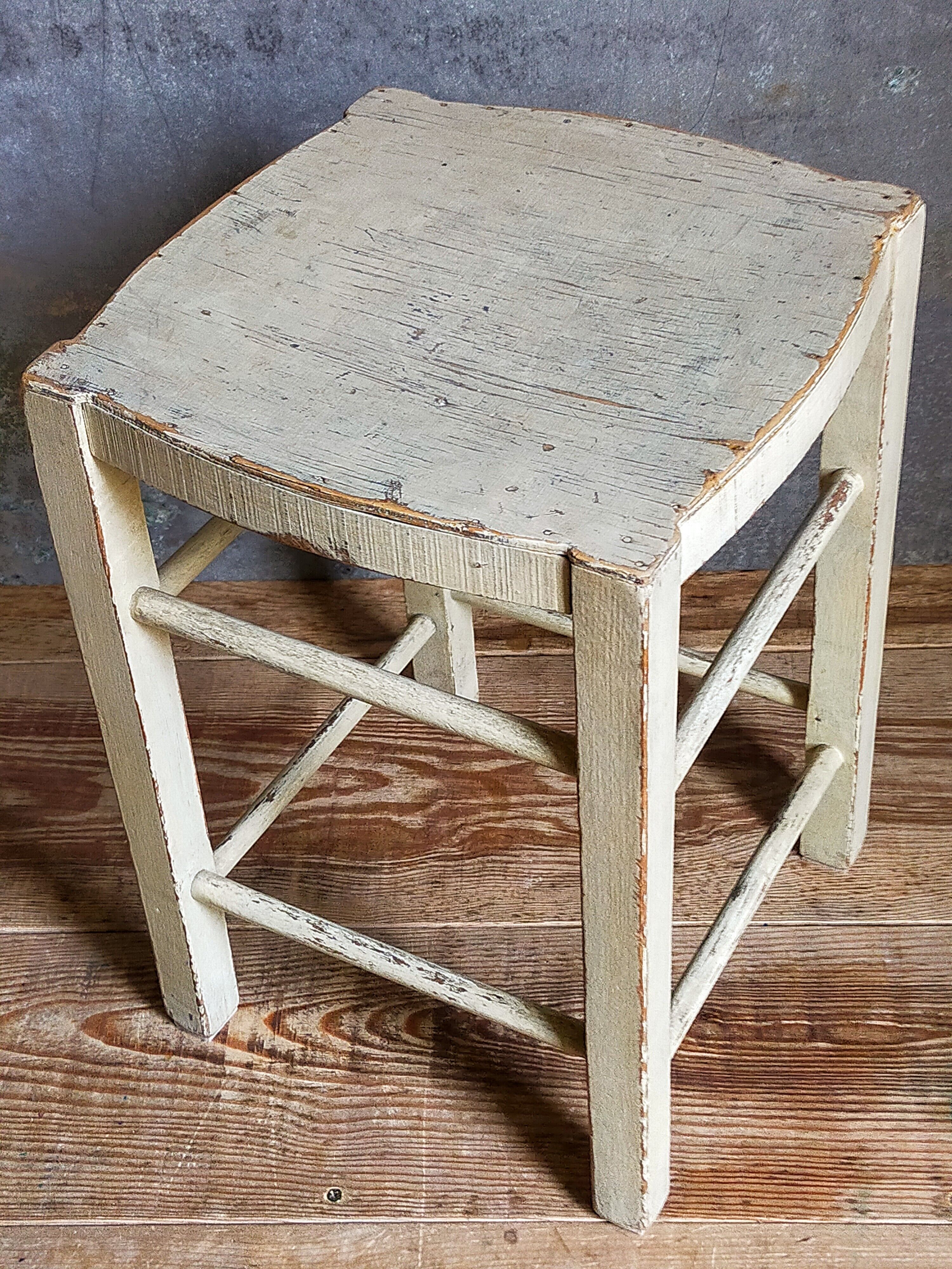 Old patinated painted wooden stool