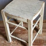 Old patinated painted wooden stool
