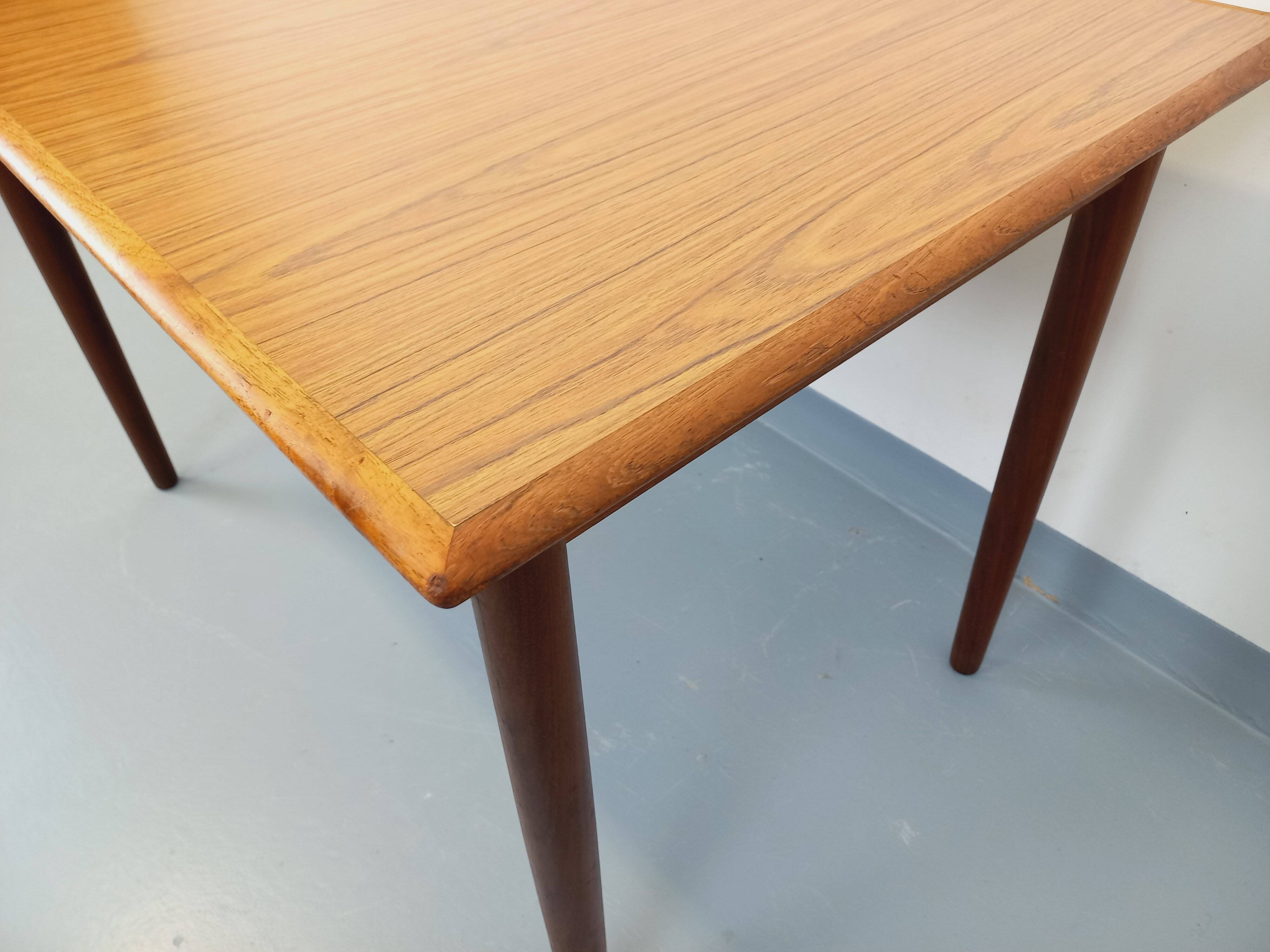 Rectangular dining table in vintage Scandinavian style made of teak and melamine.