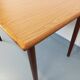 Rectangular dining table in vintage Scandinavian style made of teak and melamine.