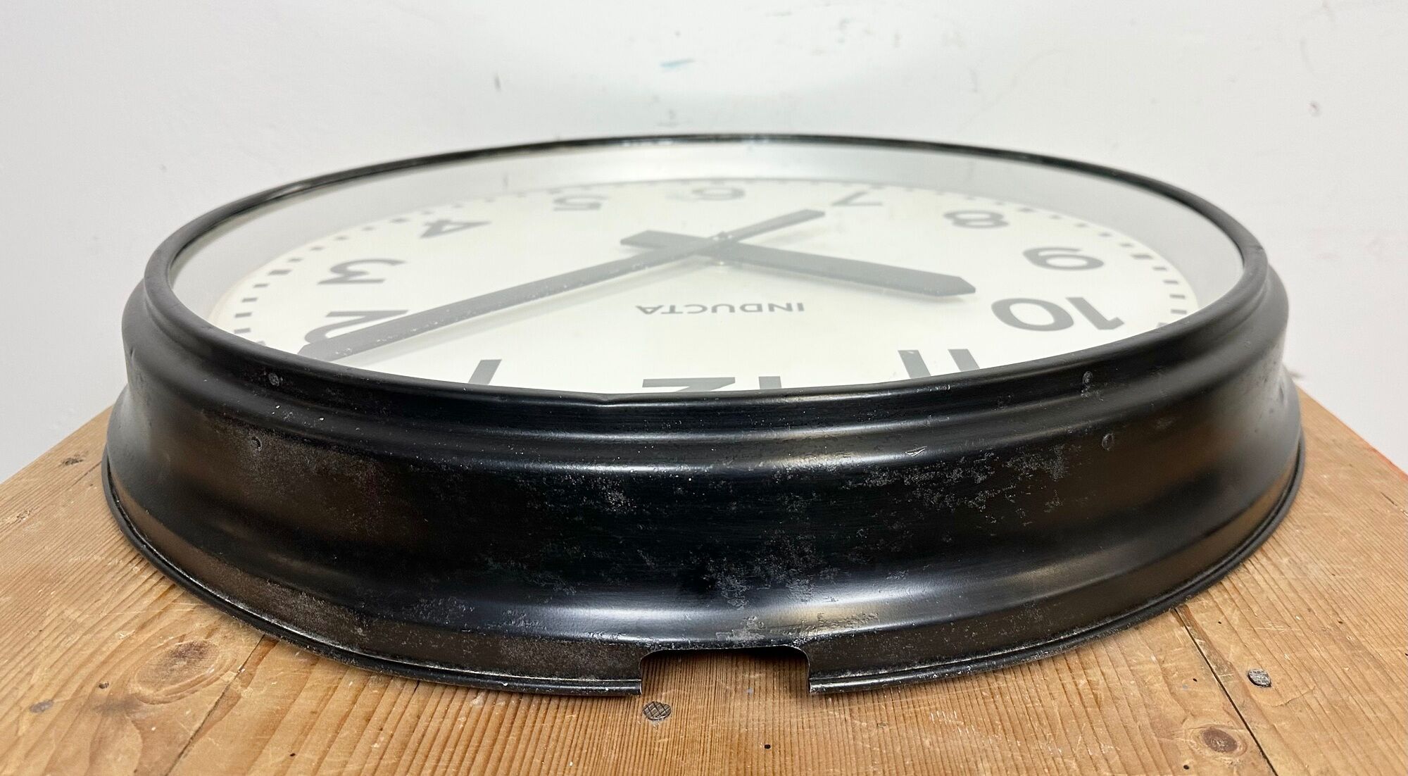 Black swiss industrial wall clock from inducta, 1960s