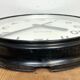 Black swiss industrial wall clock from inducta, 1960s