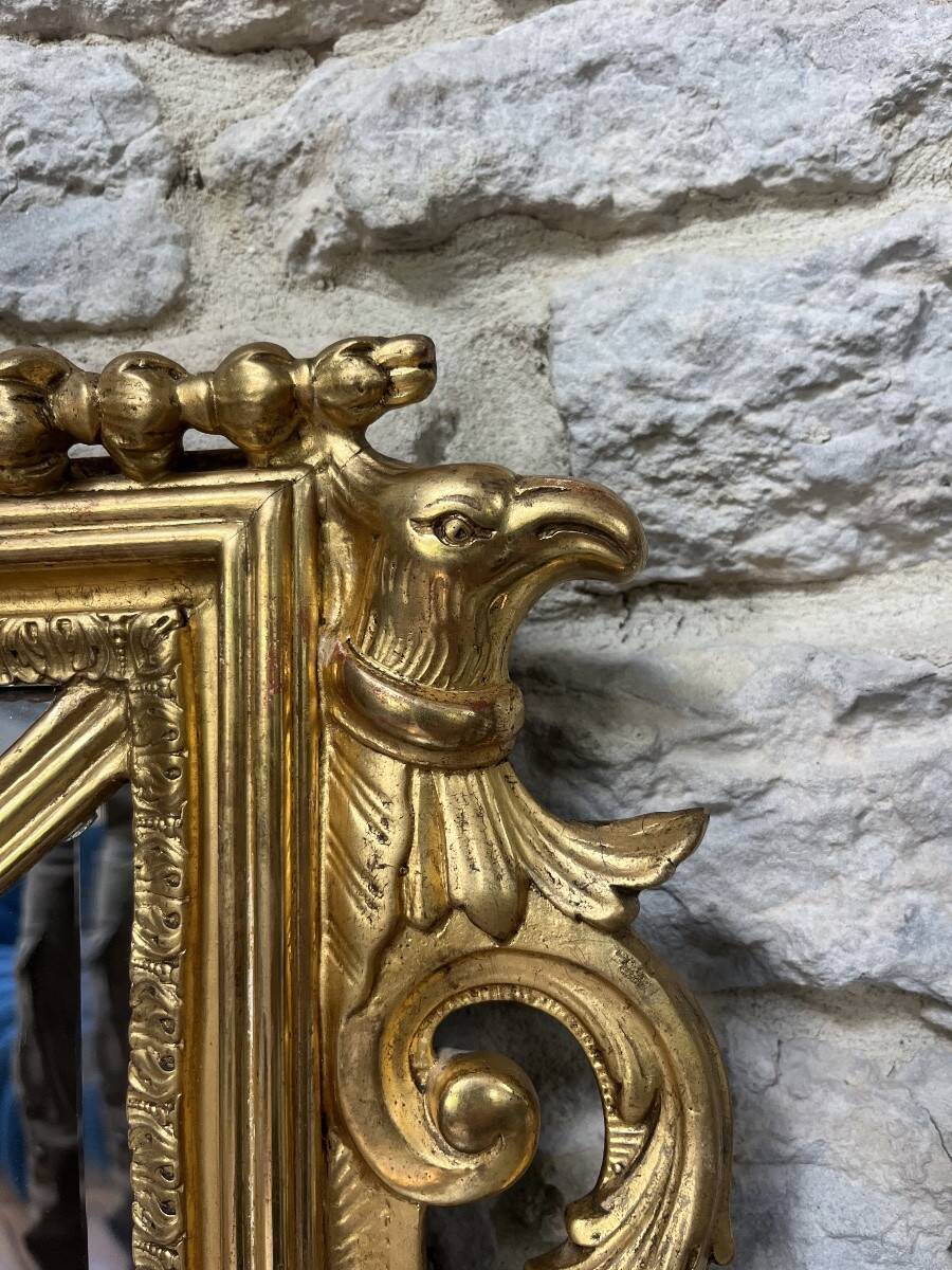 Antique mirror with a frame 123/100cm with gilded pediments, eagle heads, antique.
