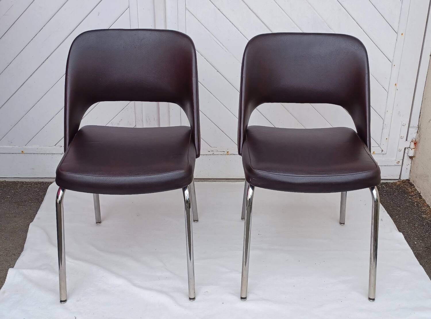 Pair of vintage faux leather and chrome armchairs