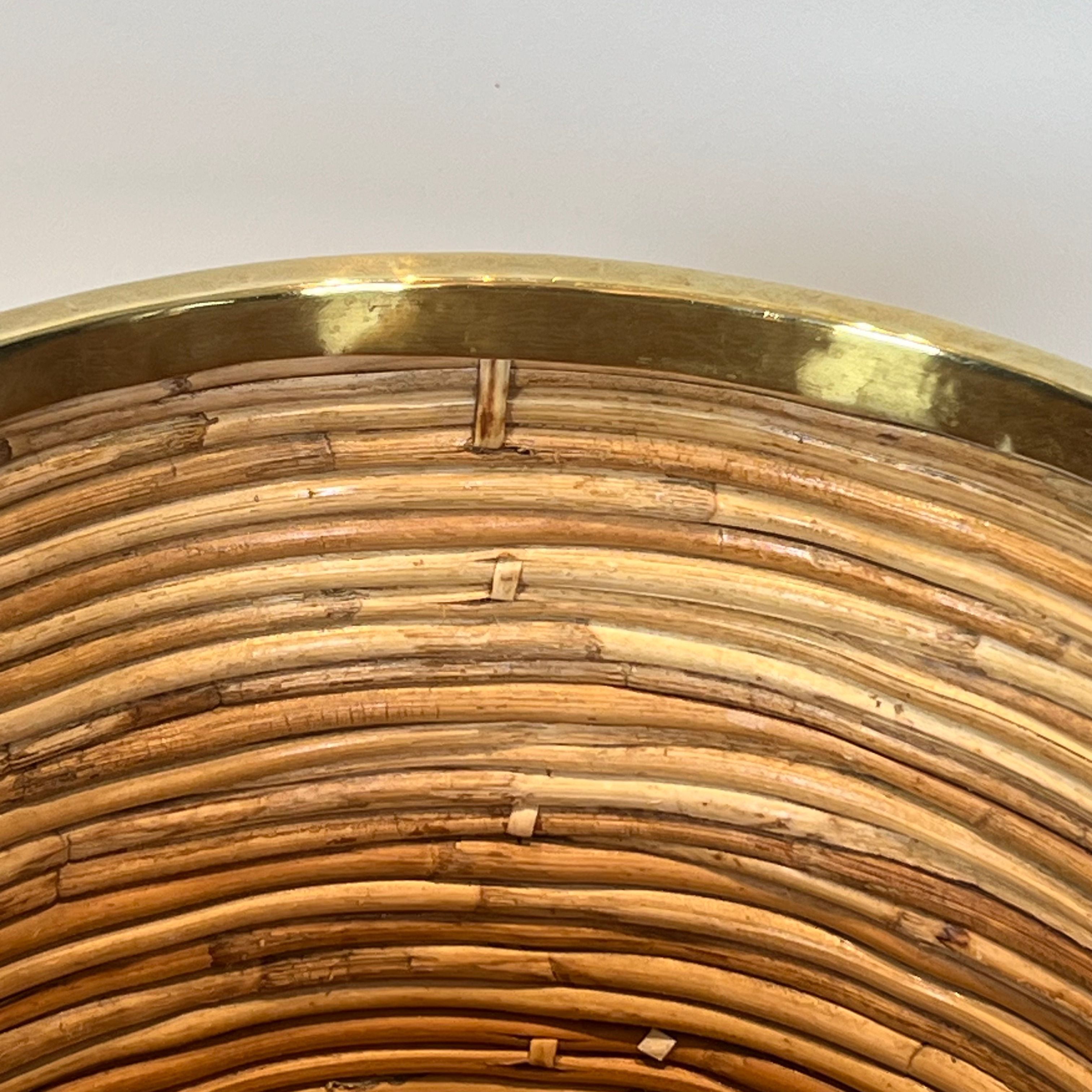 Rattan and brass wastepaper basket in the style of Gabriela Crespi.