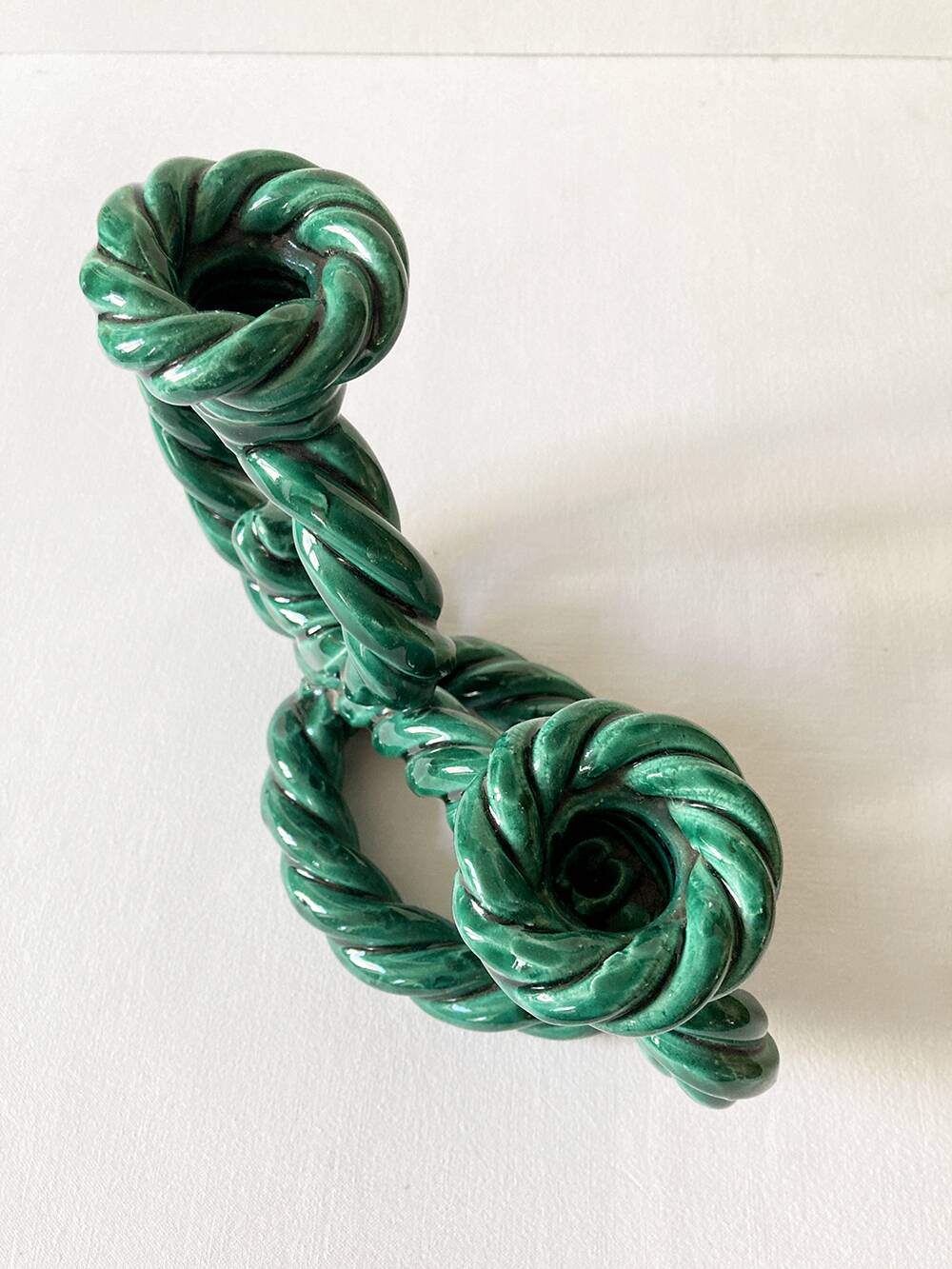 Two-armed candlestick in green glazed ceramic, braided effect
