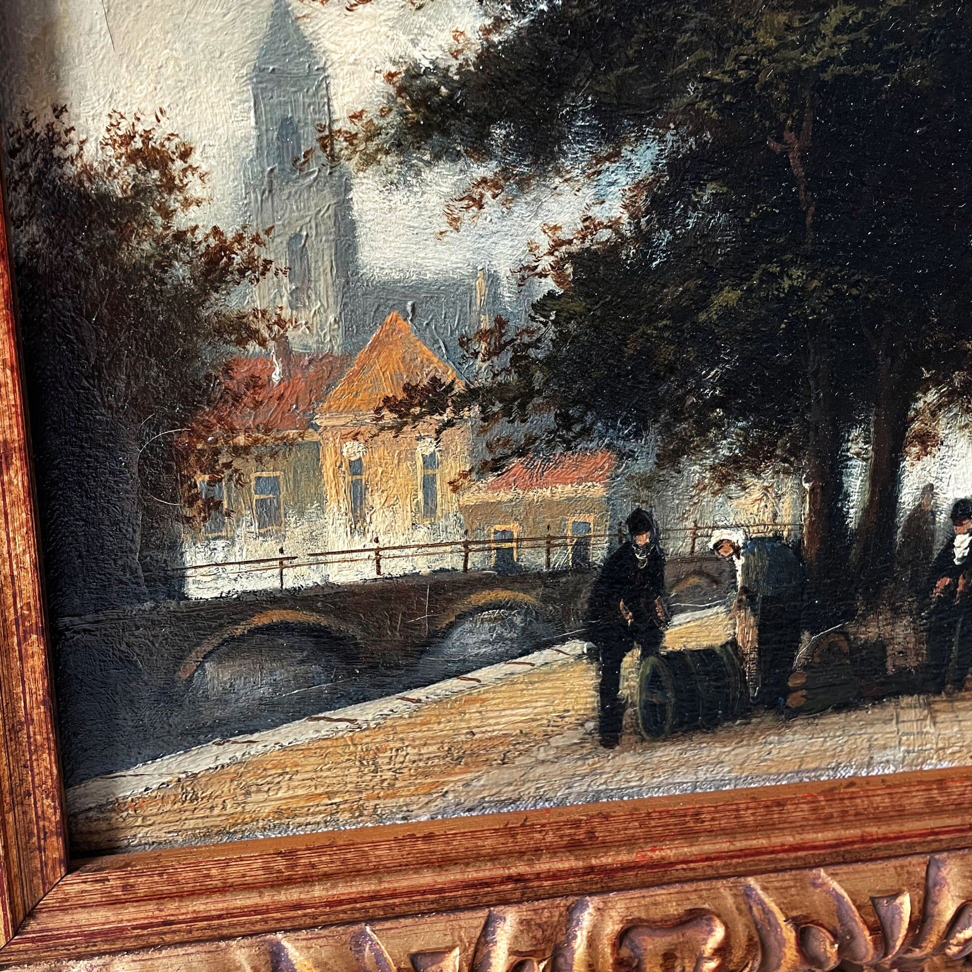 Dutch street scene oil painting in ornate frame signed Nijland