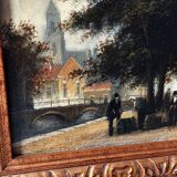 Dutch street scene oil painting in ornate frame signed Nijland