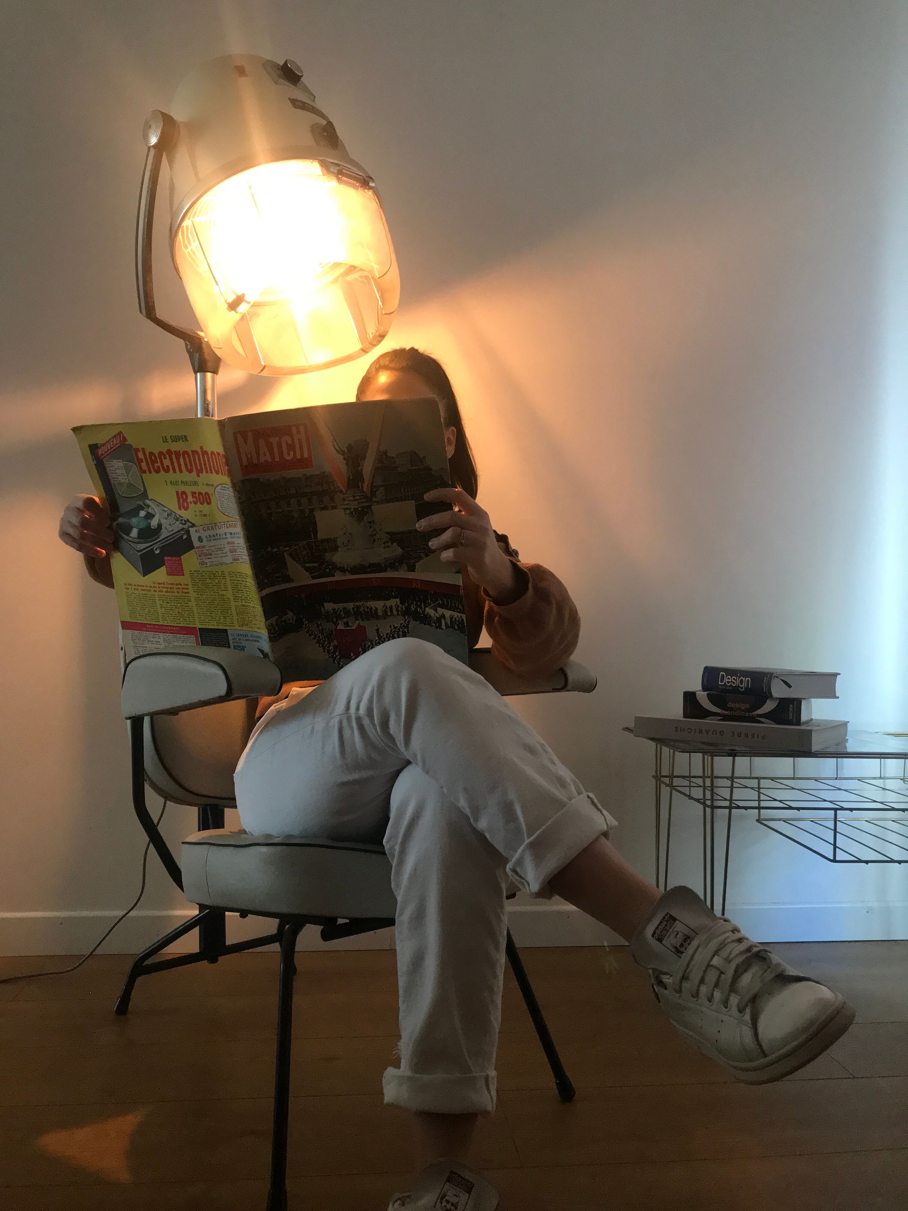 Vintage hairdresser's armchair with helmet transformed into a lamp