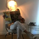 Vintage hairdresser's armchair with helmet transformed into a lamp