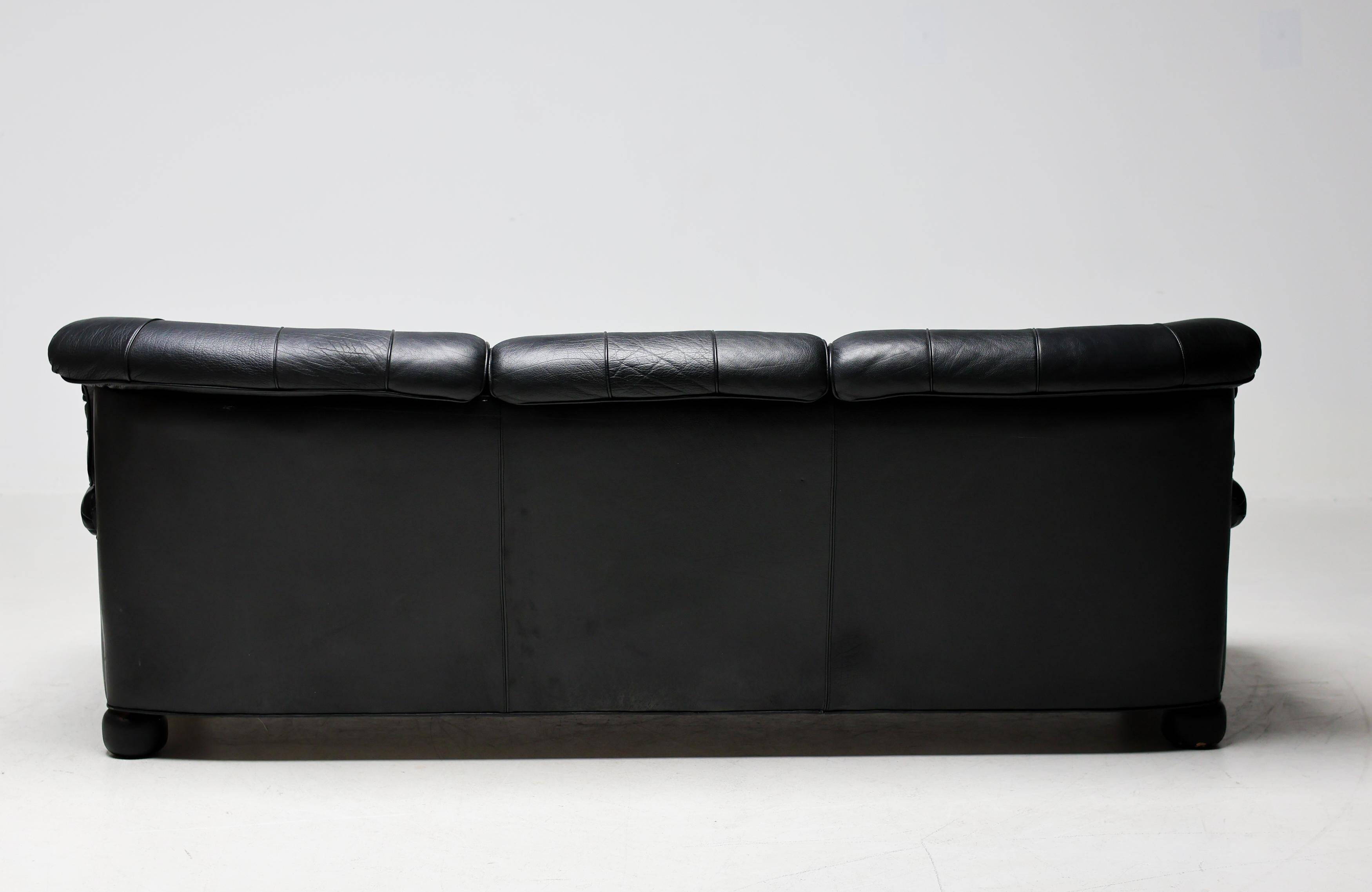 Three-seater sofa "Jupiter" in black leather by Arne Norell, Sweden, 1960.