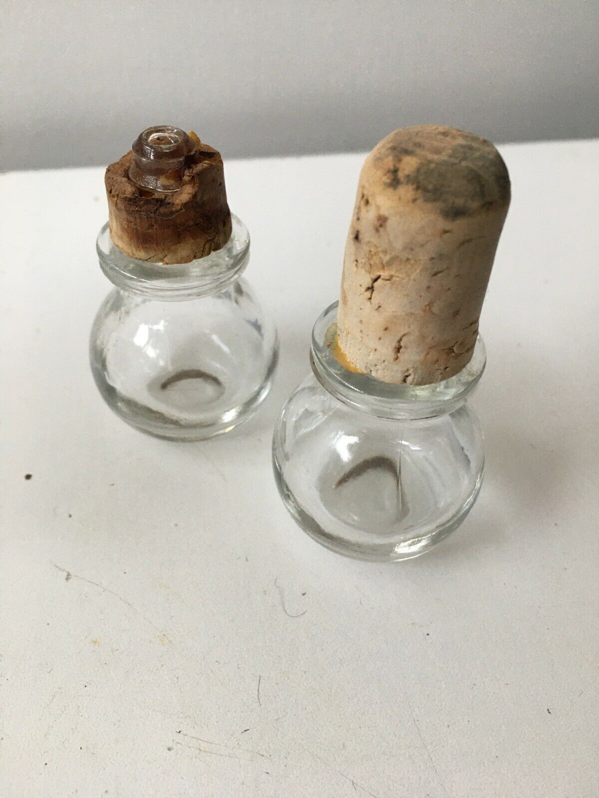 Lot of 2 old glass and tin condiment service bottles and corks