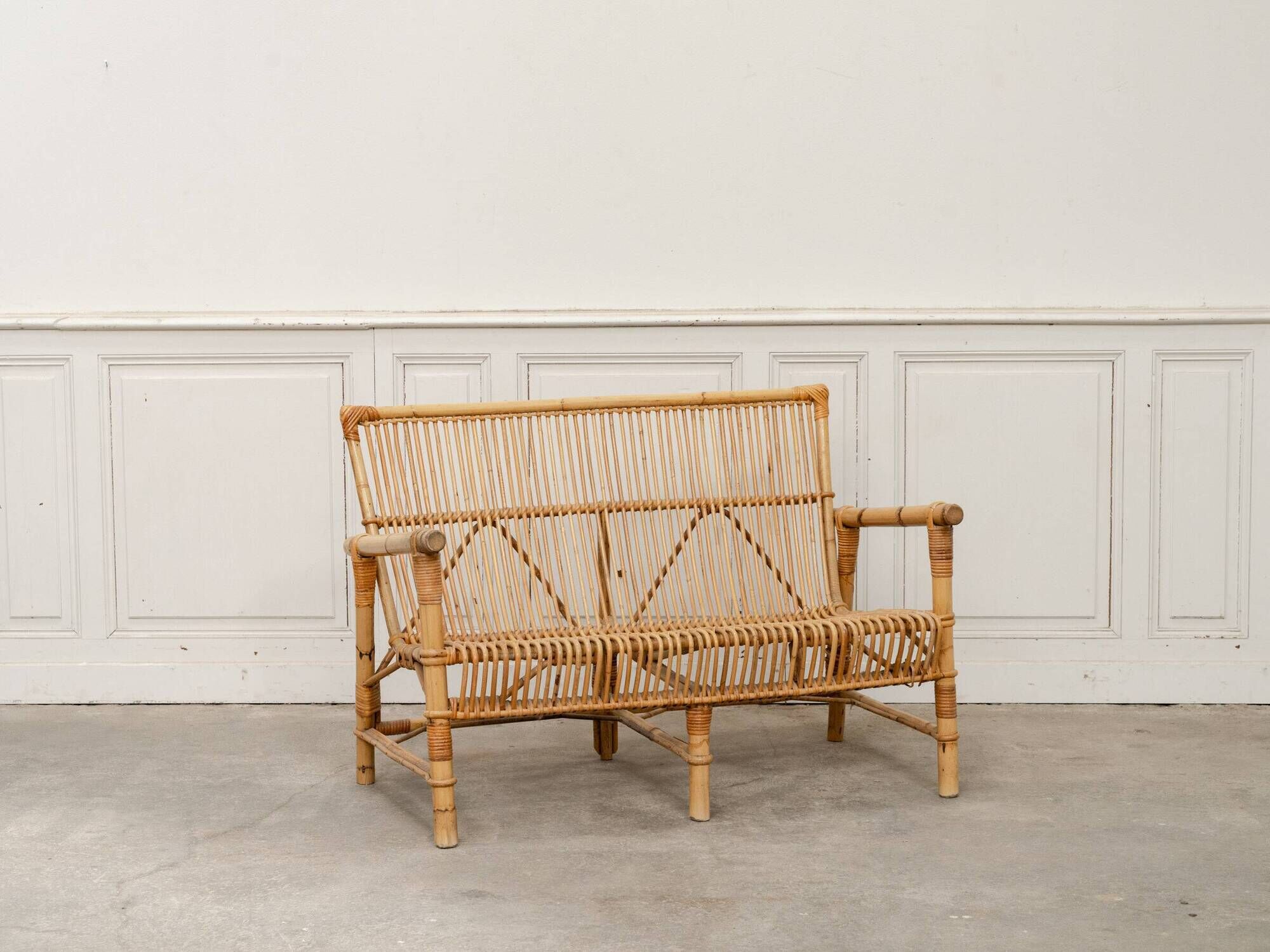 Vintage bamboo and rattan bench from the 1970s.