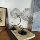 Pair of antique wall sconces with swan necks and glass globes.