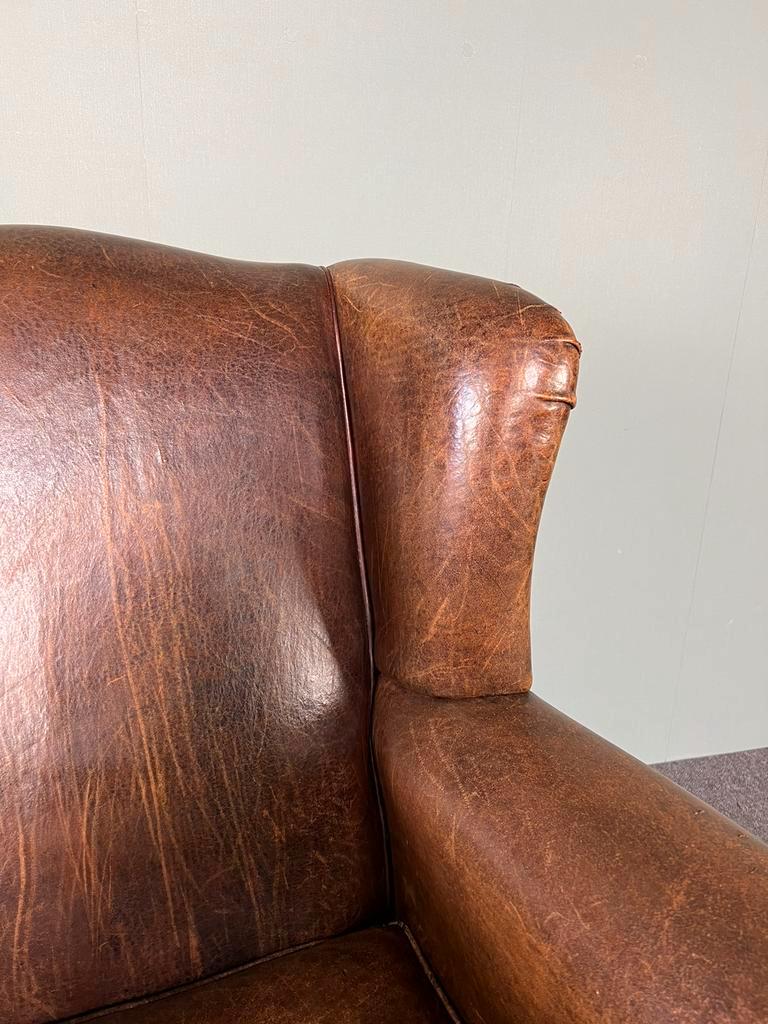 Vintage armchair in patinated sheep leather