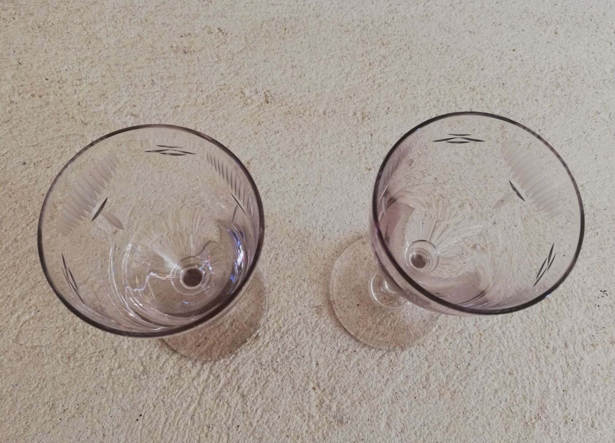 2 stemmed glasses early 20th