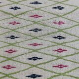 Handmade geometric patterned rug in natural wool